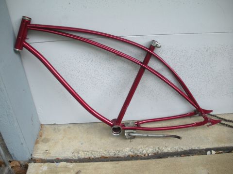 1994 Ford Bronco - A red bicycle frame with a distinctive double top tube design and cruiser-style rear dropouts is shown.