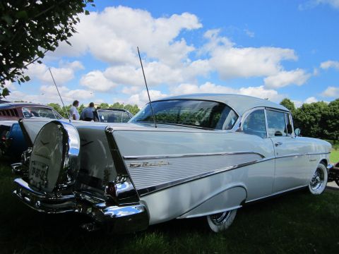 1991 Ford LTD Crown Victoria - Rear view of a classic 1957 Chevrolet Bel Air at an outdoor car show.