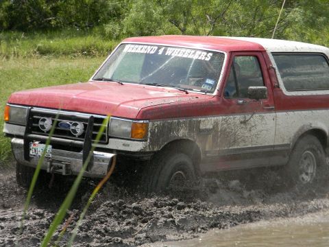 1989 Ford Bronco - This 1989 Ford Bronco is navigating a muddy off-road trail.