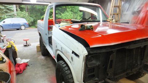 1983 Ford Bronco - Ford Bronco undergoing bodywork and paint in a garage setting.