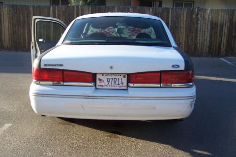 1997 Ford Crown Victoria - Mustang from the back with her VETERAN plates.