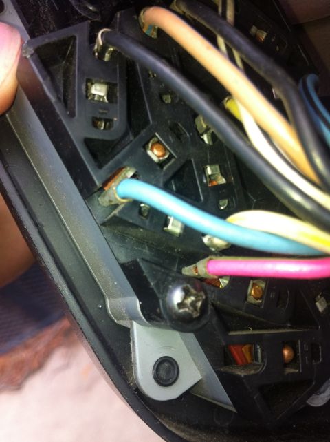 1996 Ford Bronco - Detail of a vehicle's electrical wiring connections, showing various colored wires and terminals.