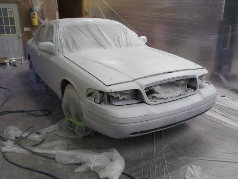 1994 Mercury Grand Marquis - This 1994 Mercury Grand Marquis is being prepped for a new paint job, with plastic sheeting covering most of the vehicle.