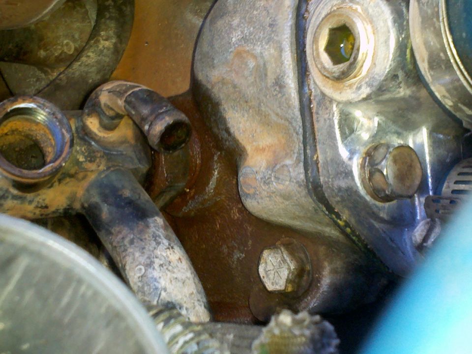 Engine part with hoses and bolts
