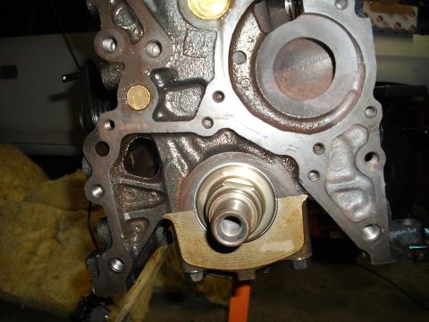 1989 Ford Probe - This is a close-up view of an engine block, focusing on the crankshaft seal and surrounding components.