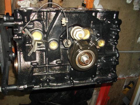 1989 Ford Probe - Close-up view of a black engine block, showing various components attached.