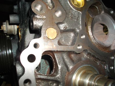 1989 Ford Probe - Engine block detail showing gasket mounting points and a small measurement gauge.