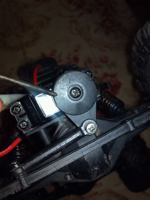 1978 Chevrolet C/K Pickup - Close-up of a remote control car's steering servo horn and linkage assembly.