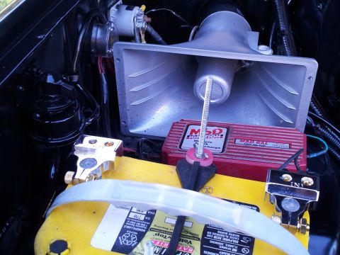 1986 Ford Bronco - Close-up of engine bay components including a battery and MSD ignition box.
