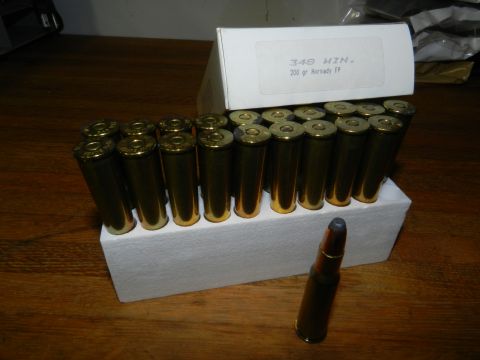 1996 Ford Bronco - A box of 348 WIN 200 grain Hornady FP cartridges is shown with one loose cartridge in front.