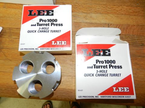 1996 Ford Bronco - Lee Pro 1000 and Turret Press 3-hole quick change turret part and boxes on a wooden surface.