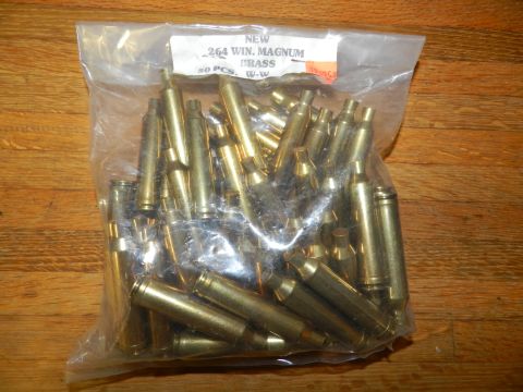 1996 Ford Bronco - Bag of 50 pieces of .264 WIN. MAGNUM BRASS casings on a wooden surface.