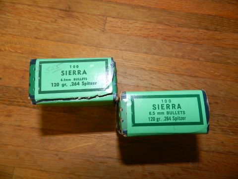 1996 Ford Bronco - Two boxes of Sierra bullets sit on a wooden surface. Each box contains 100 rounds of 6.5mm ammunition.