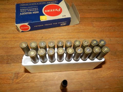 1996 Ford Bronco - A box of Peters ammunition and a tray of cartridges are displayed on a wooden surface.
