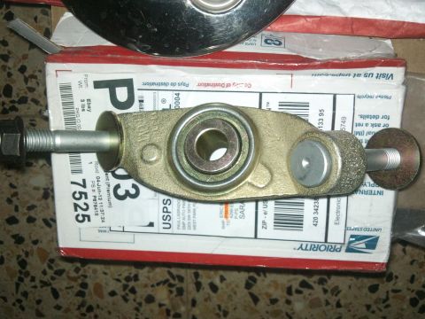 1998 Ford Crown Victoria - Automotive suspension part shown on USPS packaging, likely a replacement component for a vehicle.