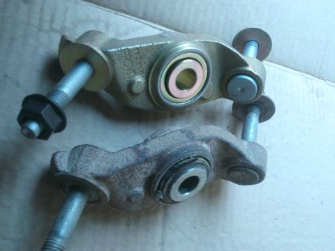 1998 Ford Crown Victoria - Comparison of a new suspension control arm next to a heavily rusted, used one.
