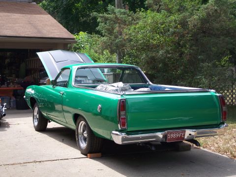 1971 Ford Ranchero - This 1971 Ford Ranchero displays its engine bay with the hood raised, viewed from the rear three-quarter angle.