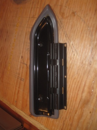 1993 Ford Bronco - Door hinge assembly with black metal and gray trim on a wooden surface.