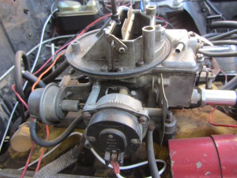 1964 Ford Ranchero - Engine bay detail showing a carburetor and associated wiring and hoses.