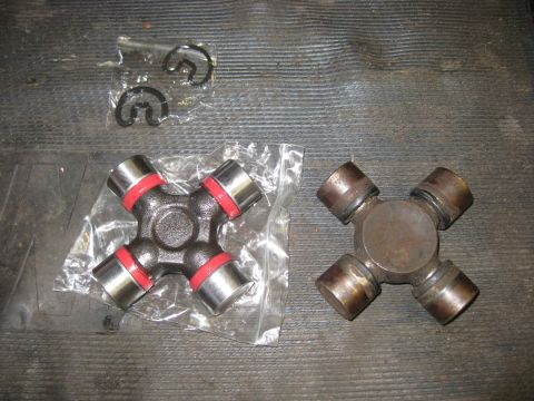 1994 Ford Bronco - Comparison of a new and old universal joint with retaining clips.