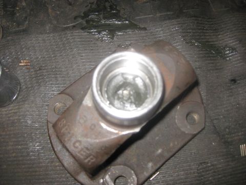 1994 Ford Bronco - This Spicer U-joint part shows signs of wear and grease, likely from a driveshaft rebuild.