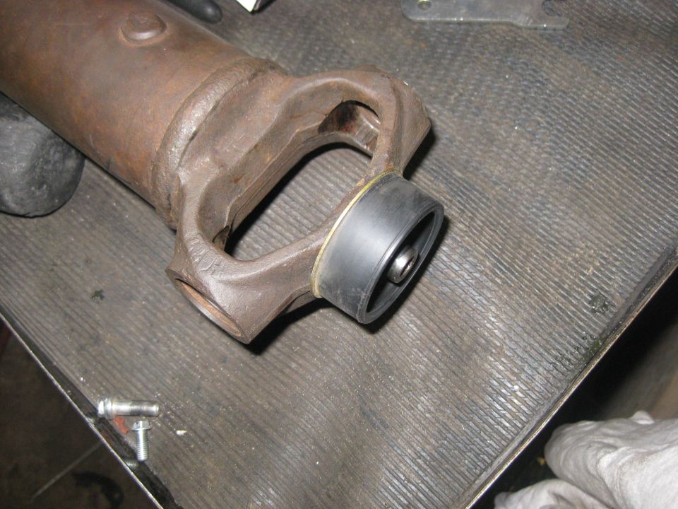 close-up of a driveshaft yoke with a new rubber boot installed