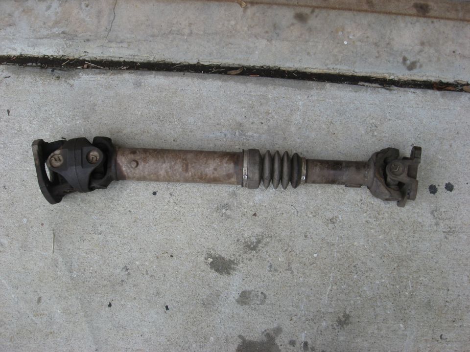 driveshaft with u-joints and a rubber boot