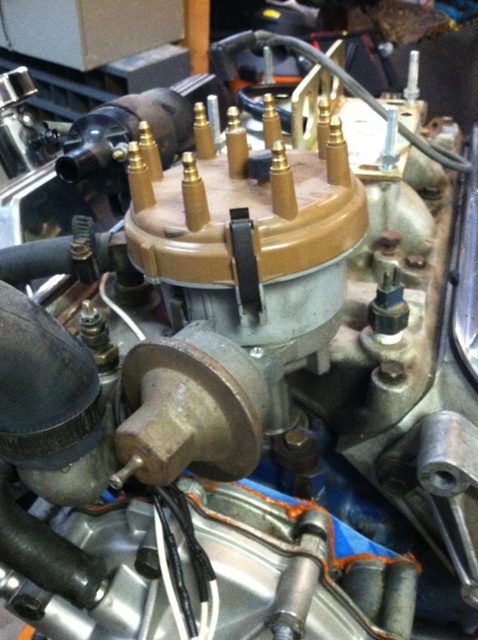 1993 Ford Bronco - Close-up of an engine's distributor cap and associated wiring.