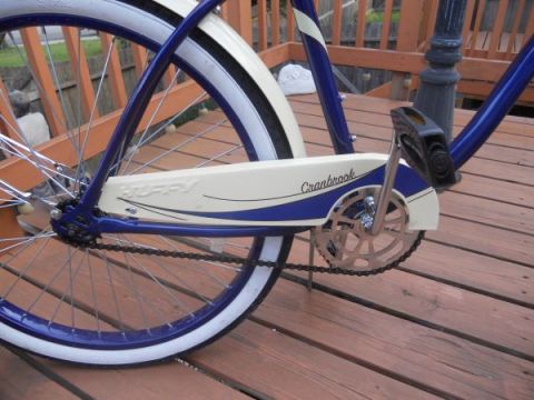 1953 Ford Mainline - A close-up view of a bicycle's chain guard and rear wheel assembly.
