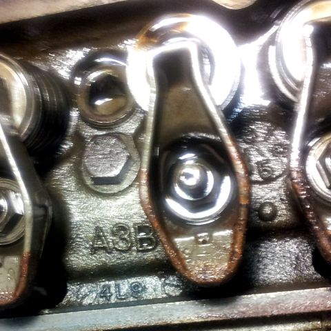 1968 Ford Mustang - Close-up view of engine valve train components, showing stamped markings.