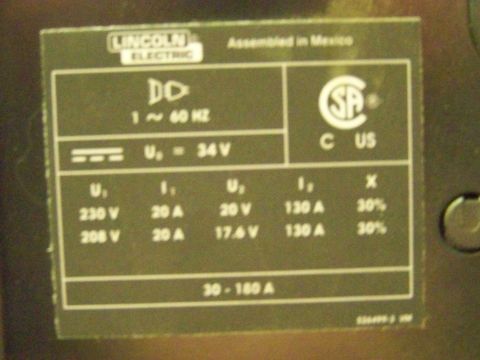 1985 Ford Bronco - A label displays electrical specifications for a Lincoln Electric device, including voltage, amperage, and frequency.