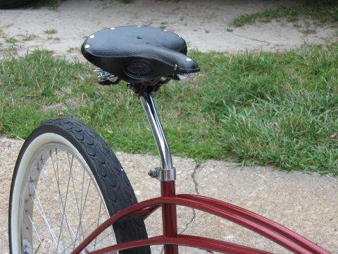 1994 Ford Bronco - Close-up view of a bicycle seat and rear wheel with a whitewall tire.