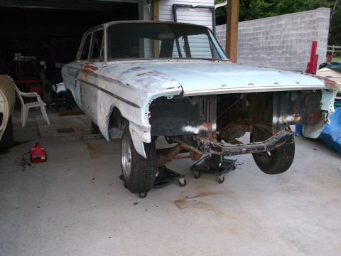 1971 Ford Ranchero - This car is undergoing some work in a garage, with its front end disassembled.
