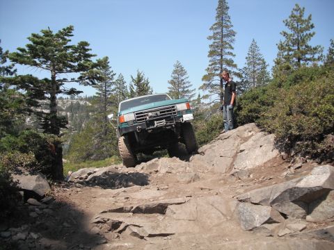 1991 Ford Bronco - This 1991 Ford Bronco navigates a challenging rocky incline on an off-road trail.