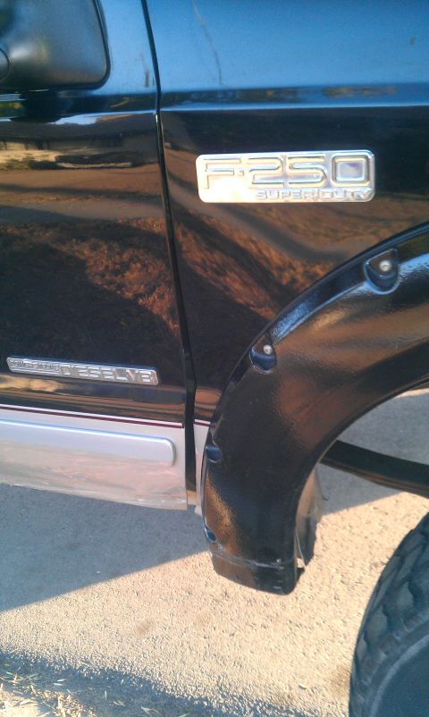 2001 Ford F-250 - Close-up of the F-250 Super Duty badge on the fender of a 2001 Ford truck.