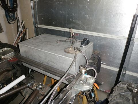 1961 International Scout 800 - Aftermarket fuel tank installation in progress, showing the tank and fuel line connections.