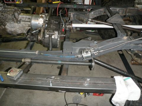 1961 International Scout 800 - The image shows the underside of a vehicle, focusing on the drivetrain and frame, likely during a custom build or repair.