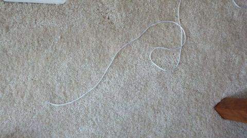 1900 Ford C-350 (Centurion Conversions) - A white cord lies on a carpeted floor, with a Supermotors logo in the lower right corner.