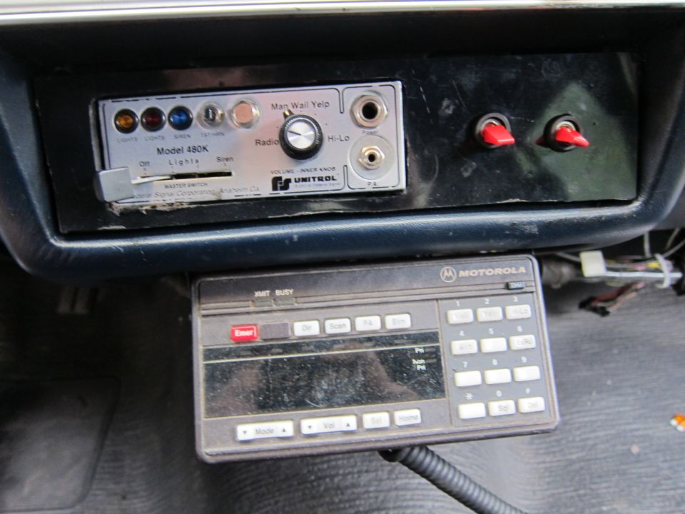 Unitrol Model 480K siren control and Motorola radio unit mounted in a vehicle