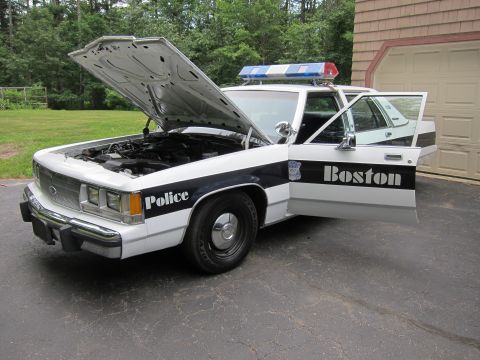 1991 Ford LTD Crown Victoria - 1991 Ford Crown Victoria LTD police car with hood and driver door open, displaying 'Police' and 'Boston' text.