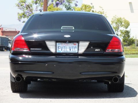 2003 Ford Crown Victoria - Close rear view showing Crown Victoria script, SVT emblem and twin exhaust tips