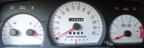 2000 Mercury Grand Marquis - The instrument cluster displays the odometer reading of 112,926 miles and the 'GRAND MARQUIS' model name.
