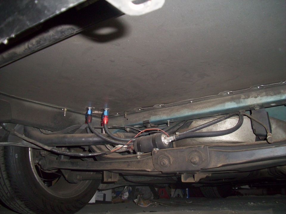 Underbody fuel filter and lines with red and blue fittings