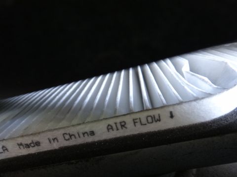 2003 Ford Taurus - Air filter showing 'Made in China' and 'AIR FLOW' directional arrow.