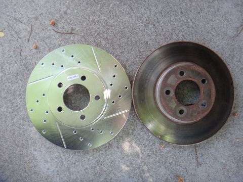 2003 Ford Taurus - Comparison of a new performance brake rotor and an old, worn-out one.