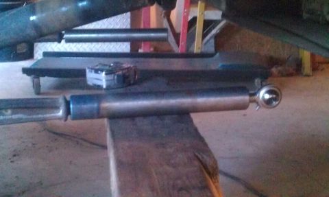 1987 Ford Bronco - A close-up view of a vehicle's suspension component, possibly undergoing maintenance or modification.