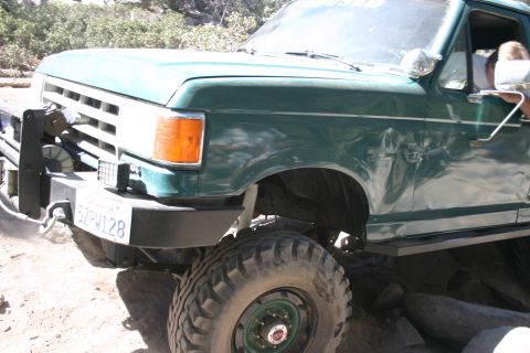 1991 Ford Bronco - 1991 Ford Bronco modified for off-road use, showing winch and large tires.