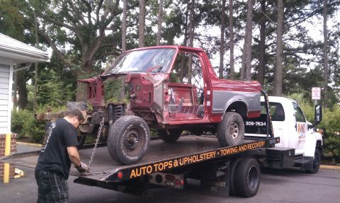 1989 Ford Bronco - This 1987 Ford Bronco body is being towed, stripped down to its frame and doors.