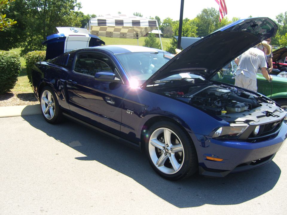 Blue 2007 Ford Mustang GT parked outside with hood and trunk open