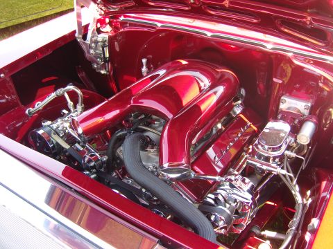 2007 Ford Mustang - Customized engine bay with polished chrome and red paintwork.